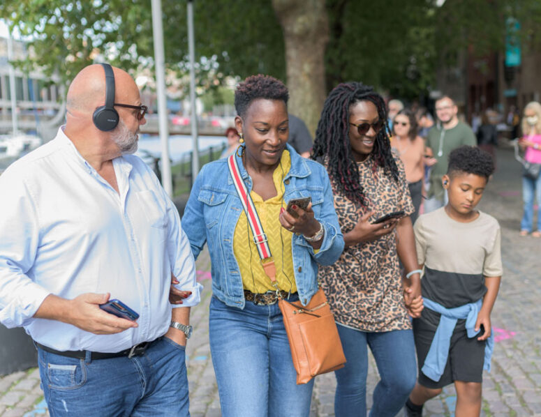 Family walking with headphones